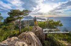hikers-on-rocks-view-of-mountains-and-coast-with-sea-in-the-evening-light-hiking-to-la-trapa[1].jpg