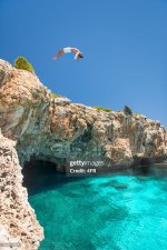 guy-jumping-off-a-cliff-into-the-ocean-mallorca-spain[1].jpg